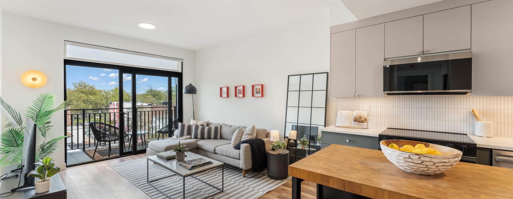 a living room with a table and chairs